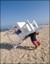 Ben Davis hauling his 300-pound lifeguard chair - by Michael W. Fincham